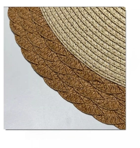 Macro view showing detailed two-tone spiral woven pattern and texture of straw sun hat