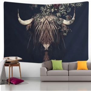 Artistic Highland cow tapestry with vintage flowers hanging above a sofa in a living room