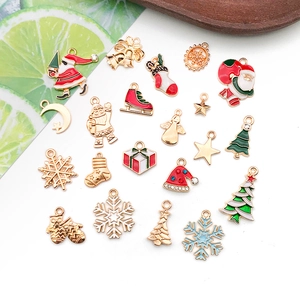 Variety of festive enamel Christmas charms for DIY jewelry making including Santa and trees