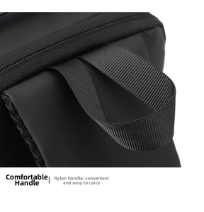 Detail view of the durable nylon top handle on this waterproof black crossbody chest bag