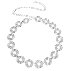 Detail of vintage silver metal waist chain with sunburst textured circular discs