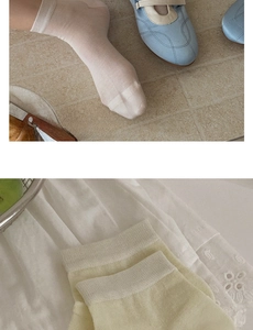 Detailed view of breathable silk short socks with ribbed cuffs in white and yellow