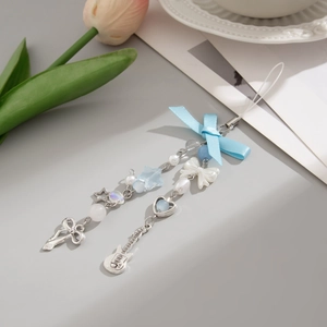 Detail of blue and white beaded phone strap with ribbon bow and star charms