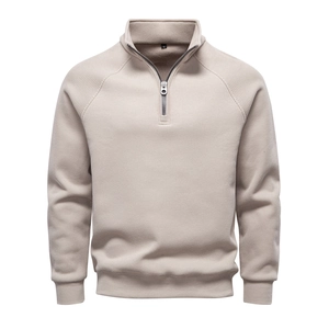 Detail of oatmeal half-zip collar and ribbed texture on men's winter pullover sweatshirt