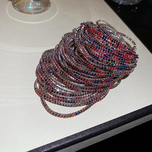 Close-up of sparkling colorful crystal stretch bracelets with silver metal base stones