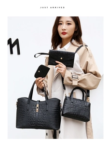 Detailed four-piece black crocodile embossed tote bag set with golden hardware details