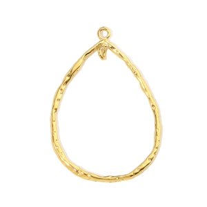 Detail of golden teardrop pendant with irregular hammered texture for DIY jewelry making