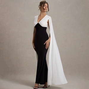 Detail of elegant V-neck long dress with floor-length white shoulder capes and slim fit