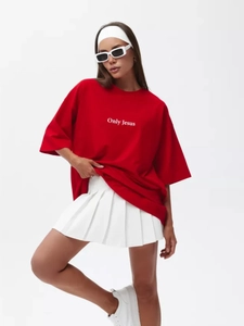 Detail of red oversized cotton T-shirt featuring white Only Jesus lettering print