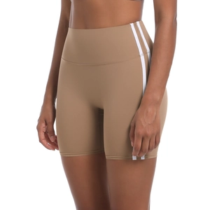 Close-up of khaki high-waisted gym shorts featuring white side stripes and breathable fabric
