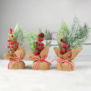 Set of 3 mini Christmas trees with pine needles, red berries, and burlap base