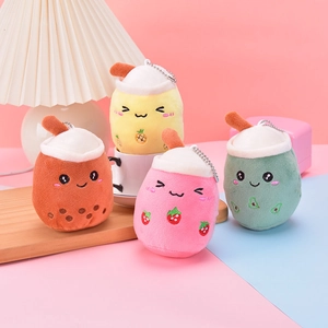 Detail of four colorful plush bubble tea keychains with fruit embroidery and metal chains