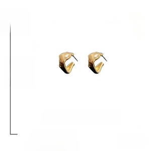 Detail view of gold irregular geometric earrings with 925 silver needles and dimensions