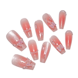 Elegant pink blush press-on nails featuring 3D butterflies and cat eye glitter finish