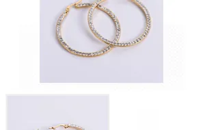 Macro detail of gold-plated square hoop earrings with sparkling crystal pavé setting