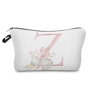 Close-up detail of the elegant pink floral alphabet letter Z print on a white makeup bag