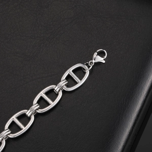 Polished silver stainless steel pig nose chain bracelet with lobster clasp on leather