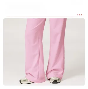 Detail view of pink high waist wide leg sweatpants with drapey fabric and loose fit