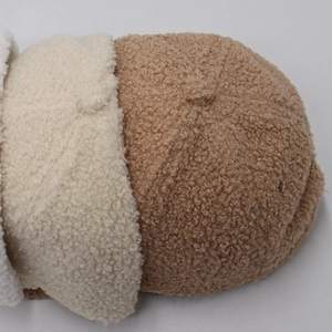 Close-up detail of soft lamb wool fabric in cream and brown for winter baseball caps