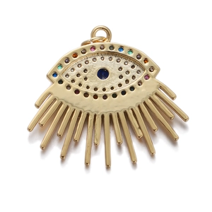 Detailed view of a gold Evil Eye pendant featuring colorful zircon stones and rays