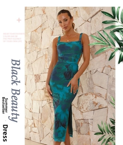 Detail view of floral print midi dress featuring a side slit and sleek sleeveless design