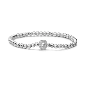 Macro shot of silver beaded bracelet featuring a micro-pave zircon letter G charm