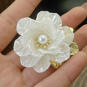 Elegant cream white camellia flower brooch with pearl accent and gold alloy petals