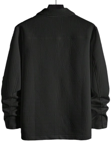 Detail of men's black jacket featuring geometric textured fabric and premium stitching