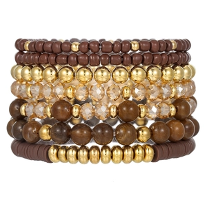 Detail of bohemian multilayer bracelet set with champagne glass and marble resin beads