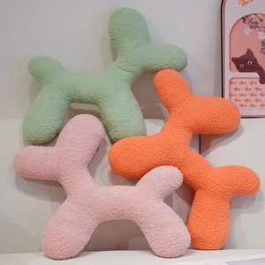 Cartoon balloon dog plush pillows in green, pink, and orange fluffy fleece fabric