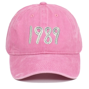 Detail of pink washed cotton baseball cap featuring high-quality 1989 3D embroidery