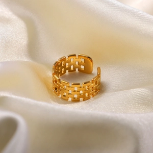 18K gold plated stainless steel watchband style open ring on soft white satin fabric