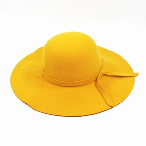 Top view of bright yellow wool felt dome hat with matching ribbon and elegant bow detail