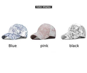 Detailed color display of vintage toile de jouy pattern baseball caps in blue, pink, and black