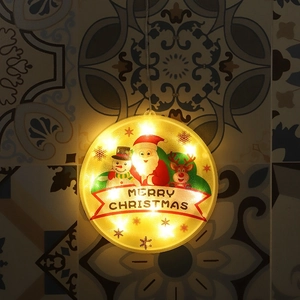 Close-up of circular LED Christmas hanging light with Santa and reindeer motifs