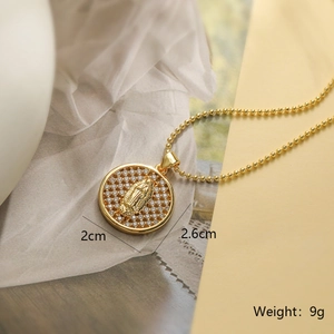 Detailed macro of 18K gold plated Mary pendant with zircon inlay and dimensions