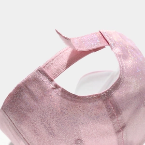 Detailed macro view of pink glitter baseball cap with adjustable velcro strap on back