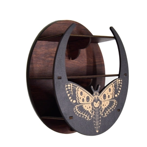 Side view of moon-shaped wooden shelf with carved moth and three-tier storage design