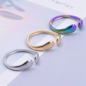 Three minimalist adjustable open rings in silver, gold, and gradient purple finishes