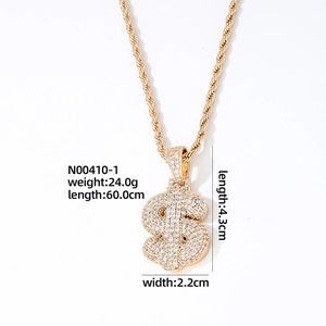 Detail view of gold dollar sign necklace with dimensions 4.3x2.2cm and 60cm rope chain