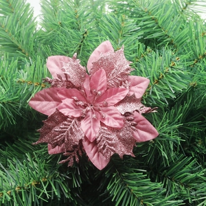 Close-up of pink glitter artificial poinsettia flower for Christmas tree decoration
