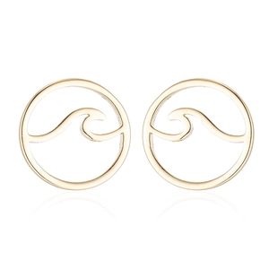 Detailed view of hollow wave pattern round stud earrings in golden stainless steel