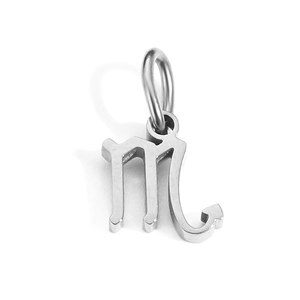 Macro shot of silver Scorpio zodiac charm with polished finish and jump ring detail