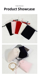 Variety of velvet drawstring jewelry pouches in multiple colors with a gold bracelet
