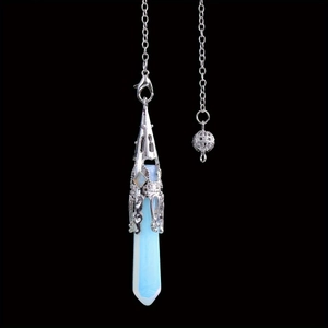 Macro view of opalite hexagonal prism pendant with silver filigree metal cap detail