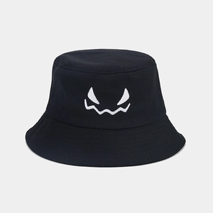 Close-up of black cotton bucket hat featuring white ghost face embroidery on the front