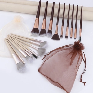 9-piece makeup brush set with various functional heads and two drawstring mesh bags