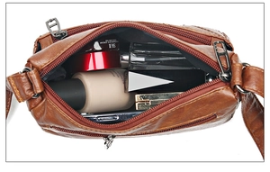 Top view of spacious brown leather crossbody bag showing large internal capacity