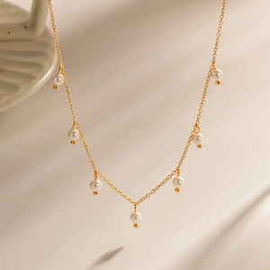 Elegant 18K gold plated stainless steel necklace with white freshwater pearl tassels