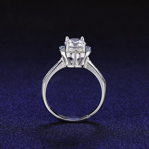 Macro view of silver wedding ring featuring halo setting and crown-shaped base structure